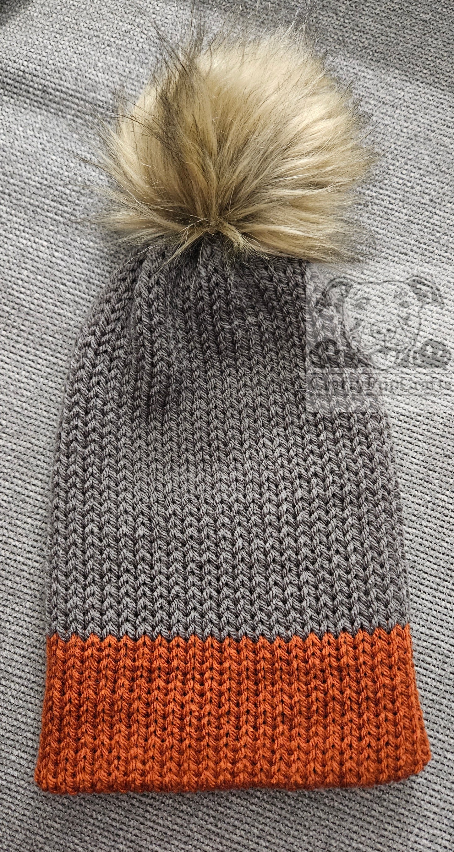 Gray & orange knit faux brim beanie with faux fur pom pom